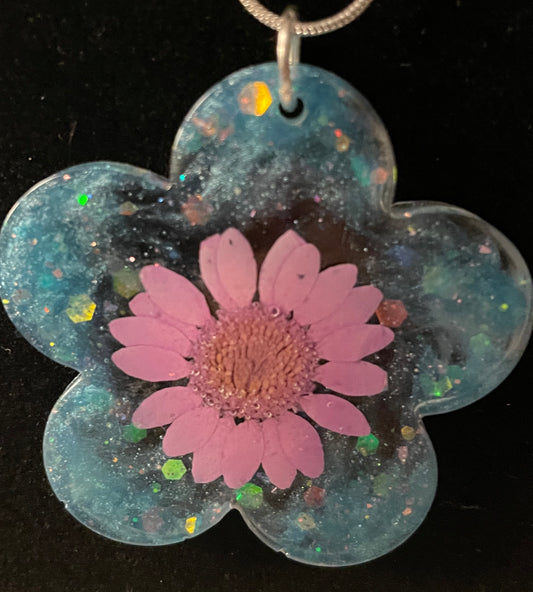 Flower Shaped Pink Flower Necklace with blue background